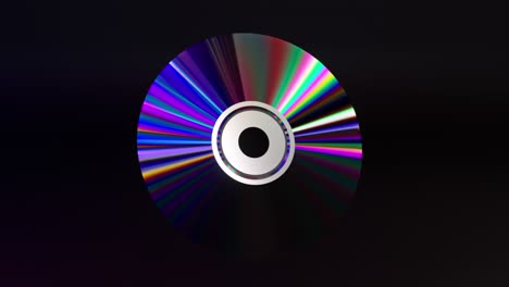 Concepto-Abstracto-Disco-Cd-Dvd-Sobre-Un-Fondo-Negro-Aislado-Neón-Azul-Color-Púrpura-Arco-Iris-3d
